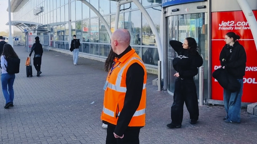 Geoffrey Swales monitoring the terminal entrance while patrolling outside Liverpool John Lennon Airport